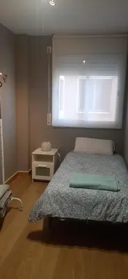 a bedroom with a bed and a window at Precioso Piso Barcelona in Santa Coloma de Cervelló