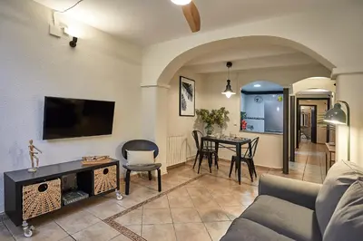 a living room with a couch and a table at BBarcelona Parallel Apartment in Barcelona