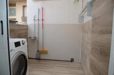 a laundry room with a washer and a washing machine at Apartamento Sofia in Pineda de Mar