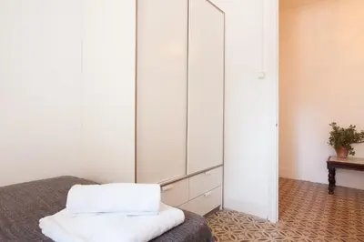 a large mirror in a room with a bed at Sagrada Familia V by Enjoy Apartments in Barcelona