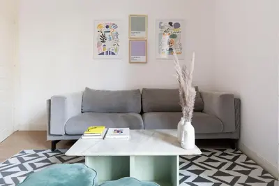 a living room with a couch and a table at Sagrada Familia II by Enjoy Apartments in Barcelona