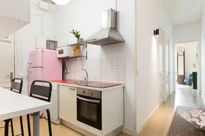 a kitchen with a sink and a stove top oven at Sagrada Familia II by Enjoy Apartments in Barcelona