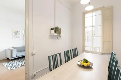 a dining room with a table with a bowl of fruit on it at Sagrada Familia II by Enjoy Apartments in Barcelona