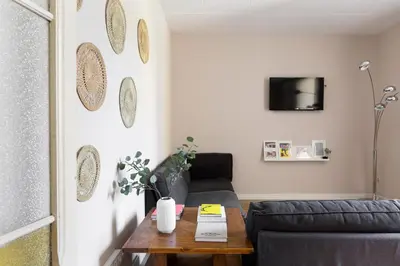 a living room with a couch and a table at Sagrada Familia III by Enjoy Apartments in Barcelona