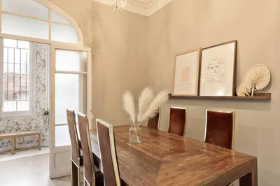 a dining room with a wooden table and chairs at Sagrada Familia I by Enjoy Apartments in Barcelona