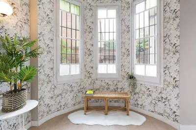 a room with a table and two windows at Sagrada Familia I by Enjoy Apartments in Barcelona