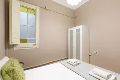 a white room with a mirror and a sink at Sagrada Familia I by Enjoy Apartments in Barcelona