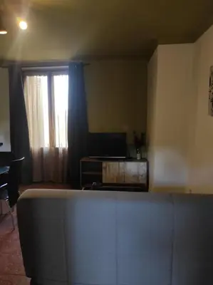 a living room with a couch and a window at Apartamentos Can bruguera 2 in Mataró