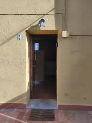 a hallway with a door leading into a room at Apartamentos Can bruguera 2 in Mataró