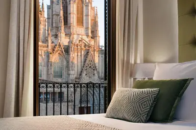 a bedroom with a view of a large cathedral at Lamaro Hotel Barcelona - Preferred Hotels & Resorts - Lifestyle Collection in Barcelona