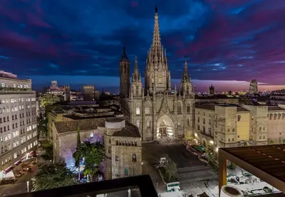a view of a large cathedral at night at Lamaro Hotel Barcelona - Preferred Hotels & Resorts - Lifestyle Collection in Barcelona