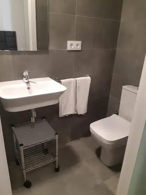a bathroom with a sink and a toilet at BCN Urbaness Hotels Bonavista in Barcelona