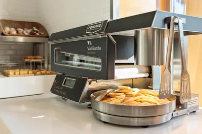 a food machine with pretzels in a bowl on a counter at Hotel Best Front Maritim in Barcelona
