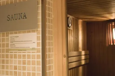 a sign for a sauna on a wall in a room at Hotel Best Front Maritim in Barcelona