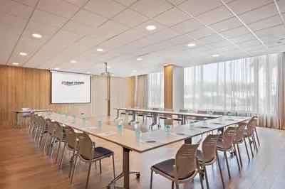 a large conference room with a long table and chairs at Hotel Best Front Maritim in Barcelona