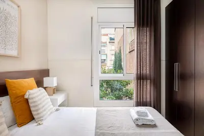 a bedroom with a bed and a window at Apartments Sata Sagrada Familia Area in Barcelona