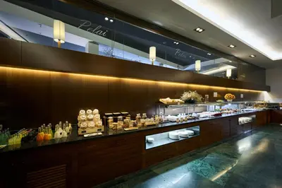 a buffet line in a restaurant with food on display at Catalonia Ramblas 4* Sup in Barcelona