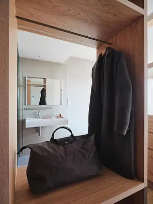 a bathroom with a black bag and a sink at Qgat Restaurant Events & Hotel in Sant Cugat del Vallès
