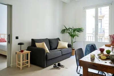 a living room with a couch and a table at Eco Boutique Hostal Grau in Barcelona