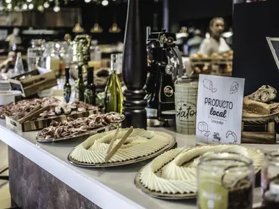 a table topped with plates of food on a table at Novotel Barcelona Cornellà in Cornellà de Llobregat
