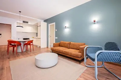 a living room with a couch and chairs and a table at Sweett - Casa Bailen in Barcelona
