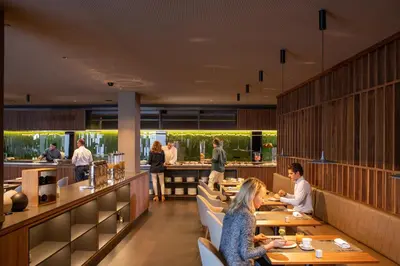 a restaurant with people sitting at tables at BAH Barcelona Airport Hotel in El Prat de Llobregat