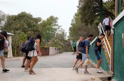 a group of people waiting to get on a train at Inout in Barcelona