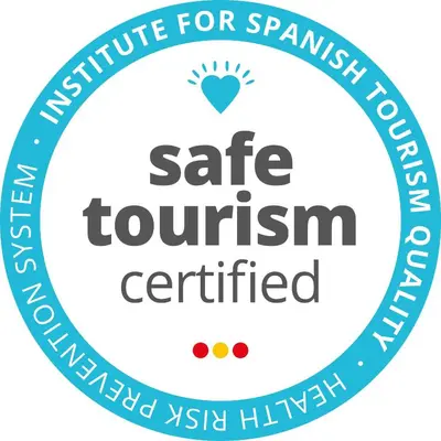 a circle with the text safe tourism certified in the middle at Inout in Barcelona