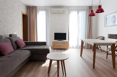 a living room with a couch and a table at MH Apartments S. Familia in Barcelona