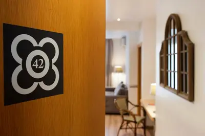 a room with a door with a sign on it at MH Apartments S. Familia in Barcelona
