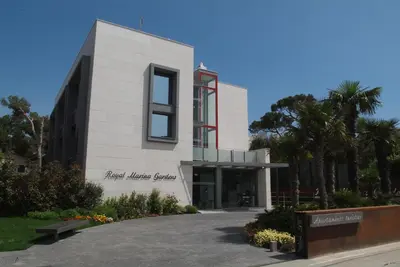 a building with a sign in front of it at Apartamentos Royal Marina Gardens in Castelldefels