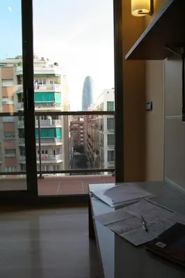 a office with a view of a city from a window at Apartaments Aragó565 in Barcelona
