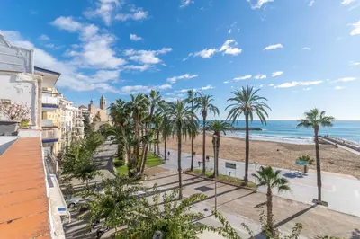 a view of the beach from the balcony of a condo at Vistamar 2: Primera línea de mar con gran terraza in Sitges