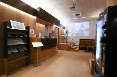 a large room with a lecture room with a slide at Hotel Esplugues in Esplugues de Llobregat