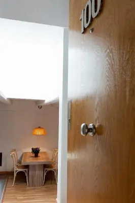 a door leading into a dining room with a table at MH Apartments Liceo in Barcelona