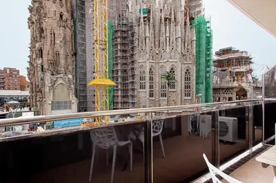 a patio with a table and chairs on a balcony at Suites4days Provenza Apartment in Barcelona