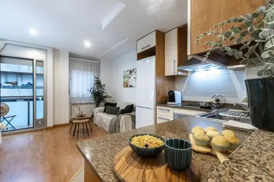 a kitchen and living room with a counter top at Fantástico loft cerca centro by Lofties in Terrassa