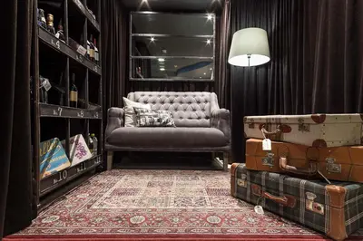 a living room with a chair and a pile of luggage at Acta BCN 40 in Barcelona