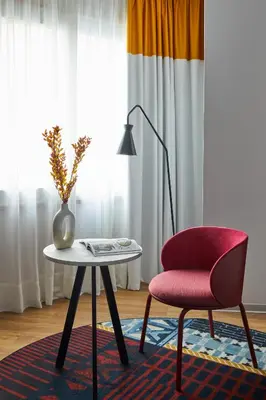 a bedroom with a blue accent wall and a bed at Hotel Indigo Barcelona Plaza Espana by IHG in Barcelona