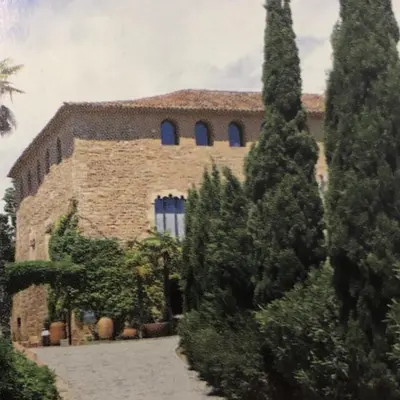 a large brick building with trees in front of it at Colors in Barcelona
