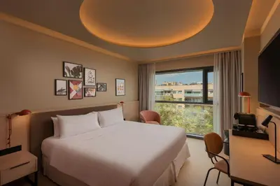 a hotel room with a bed and a window at Four Points by Sheraton Barcelona Diagonal in Barcelona