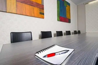 a pen sitting on a notebook on a table at Llagotel in La Llagosta