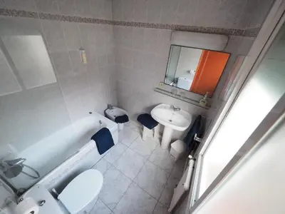 an overhead view of a bathroom with a sink and a mirror at Hotel Montserrat in Sitges