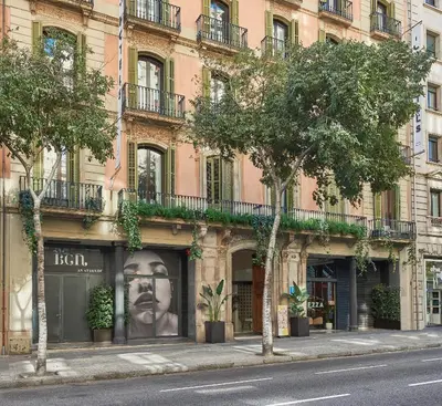 a building on a street with trees in front of it at ICON Bcn in Barcelona