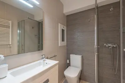 a bathroom with a toilet and a sink and a shower at Mare Nostrum: En el corazón de Sitges in Sitges