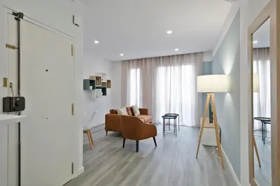 a living room with a couch and a table at Alcam Badalona Roger in Badalona