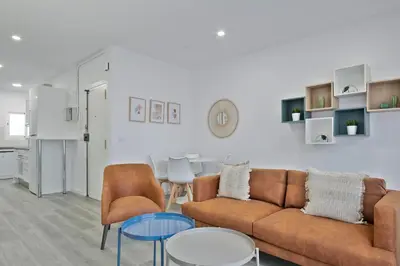 a living room with a couch and a table at Alcam Badalona Roger in Badalona