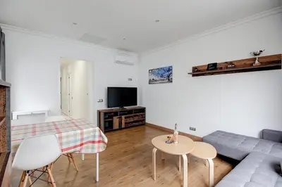 a living room with a couch and a table at Barcelona Beach Vibes in Sant Adria de Besos