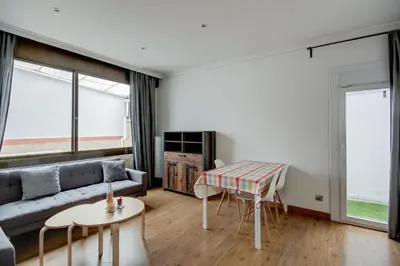 a living room with a couch and a table at Barcelona Beach Vibes in Sant Adria de Besos