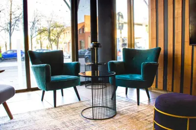 a group of chairs and a table in a room at Hotel HC*** Mollet Barcelona in Mollet del Vallès
